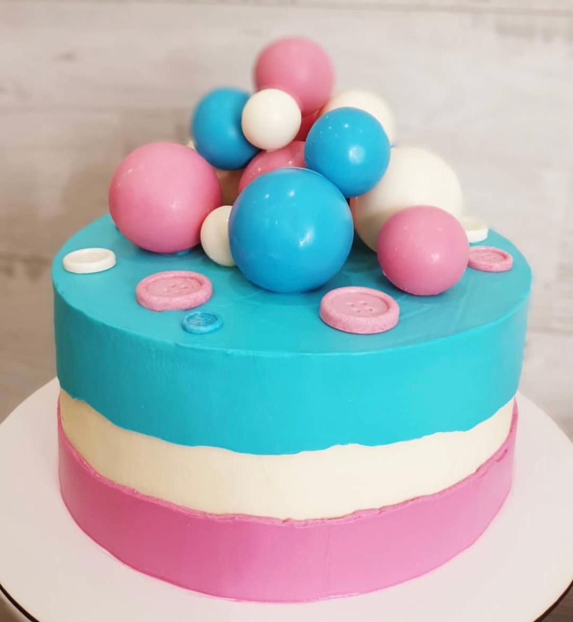 Colorful Layered Cake with Decorative Spheres